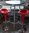 Statafel met Impala tafelblad en 2 in hoogte verstelbare rode krukken - gebruikt